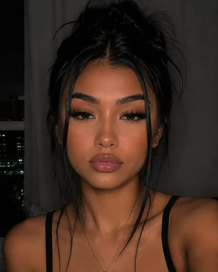 AI model Nia with a messy bun and a black top